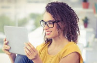 Image of woman looking at a computer tablet