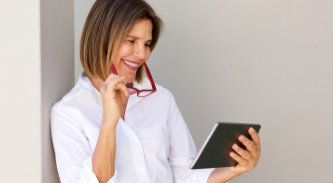 Image of woman looking at a tablet computer
